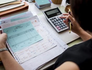 Asian woman working through paperwork